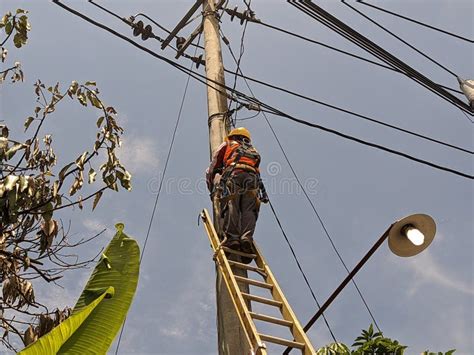 Workers Repair Low-voltage Power Lines on a Regular Basis Stock Image ...