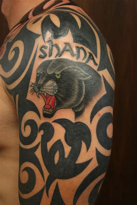 Panther tribal tattoo on shoulder