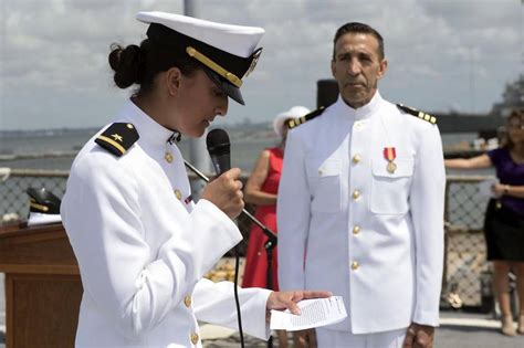 Ensign commissions her 63-year-old father as a Navy officer