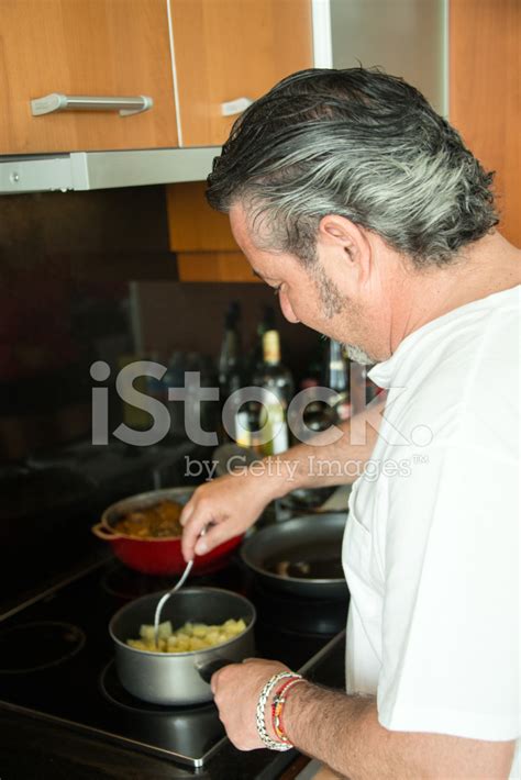 Single Man Cooking His Dinner Stock Photo | Royalty-Free | FreeImages