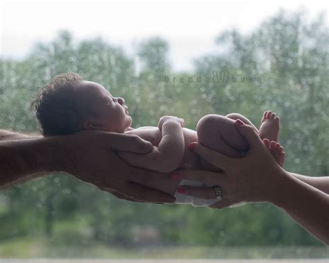 Parents hands holding newborn baby. Newborn photo by Brenda Bush ...