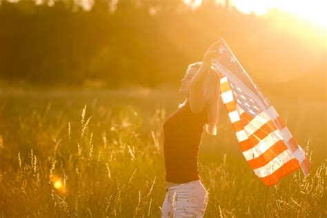 Premium Photo | Beautiful young woman with usa flag