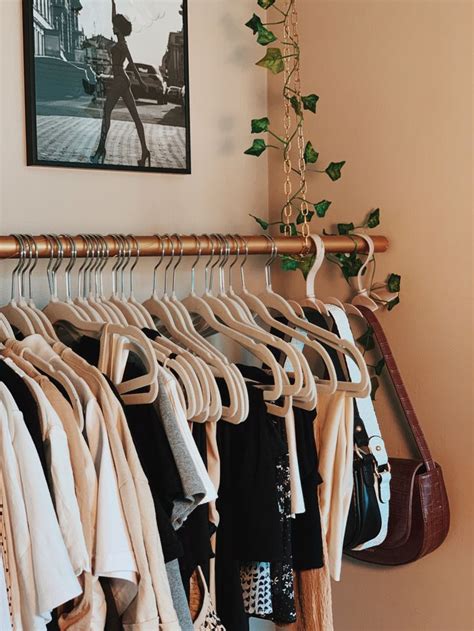 hanging clothing rack beige aesthetic | Clothing rack bedroom, Clothing ...