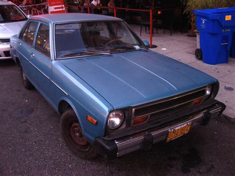 OLD PARKED CARS.: 1979 Datsun 210 Sedan.