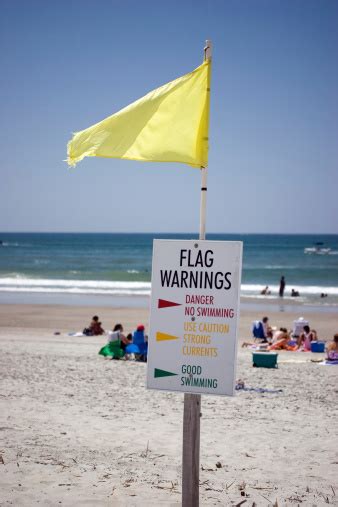 Yellow Beach Flag Stock Photo - Download Image Now - iStock