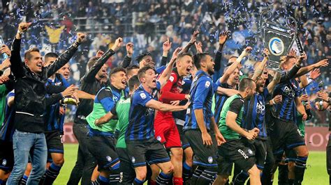 Atalanta players celebrate reaching next year's Champions League. They beat Sassuolo 3-1 in the ...