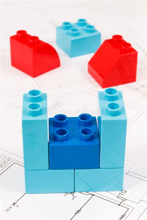 Colorful Toy Blocks and Construction Housing Plan. Building, Buying or ...