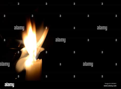 A candle captured under low shutter speed, different shapes taken by a simple flame, long ...