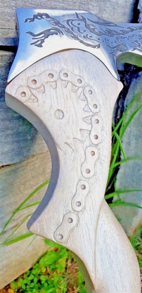 Hand carving on timber axe handle of chain and sprocket | Best pocket knife, Axe handle ...