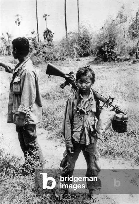 A child soldier in the army of marshal Lon Nol, Cambodia, March 1975 (b/w photo) by Unknown ...