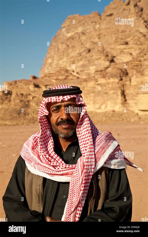 A Bedouin man wearing the red-and-white checkered keffiyeh scarf in ...