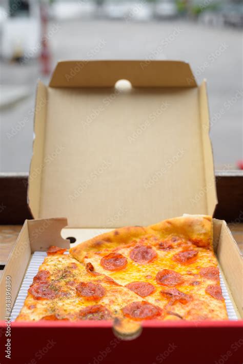 New York City style Italian pepperoni pizza slices in take away box Stock Photo | Adobe Stock