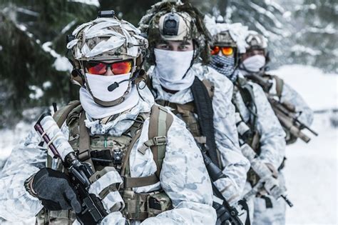 Premium Photo | Squad of soldiers in winter forest