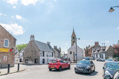 A Busy Kilmaurs Main Street and Ancient Jail with its Steeple an ...