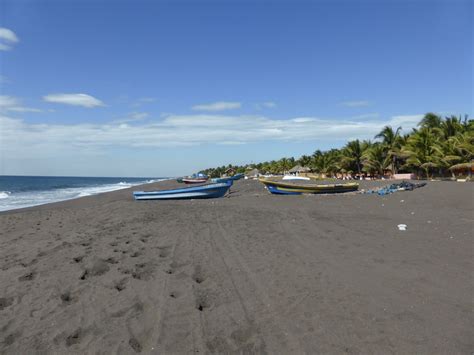 Looking north along the black sands of Monterrico beach - A Picture ...