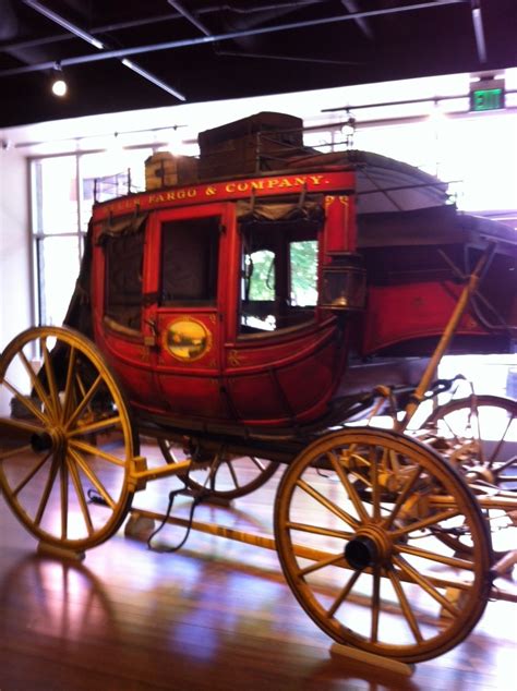 a horse drawn carriage on display in a museum