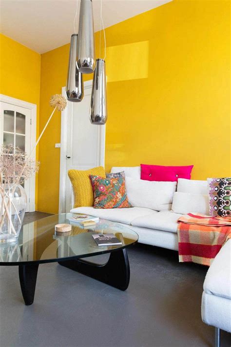 9 Stimulating Ways to Use Yellow In Your Staying Space | Yellow living room, Yellow walls living ...