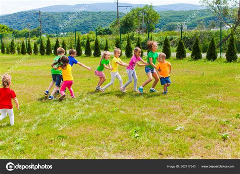 Children summer camp outdoor games Stock Photo by ©oksixx 202717240