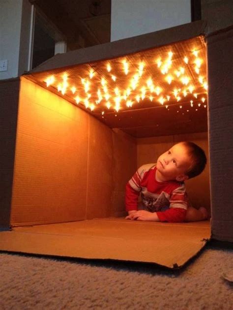 cardboard box + lights = fort | Kids forts, Toddler fun, Activities for kids