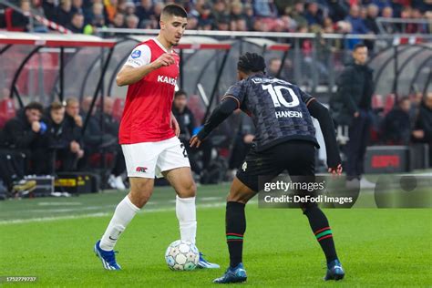 Mayckel Lahdo of AZ Alkmaar and Sontje Hansen of NEC Nijmegen battle... News Photo - Getty Images