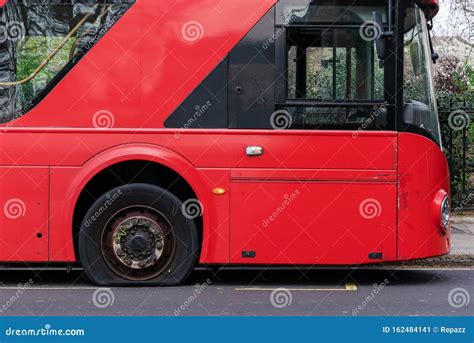 Deflated Tire on the London Bus Stock Image - Image of wheel, worn: 162484141