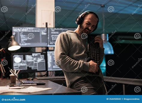 Male Software Engineer Playing Guitar with Keyboard Stock Photo - Image ...