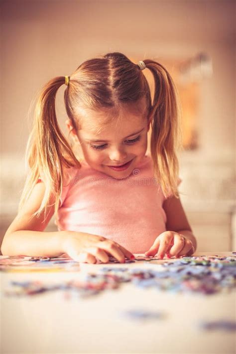 Puzzles is Interesting for Play. Stock Photo - Image of cute, girl: 118471448