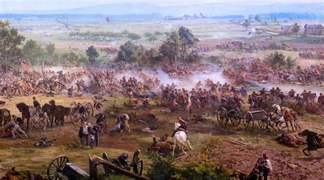 an image of a battle scene with men on horses and wagons in the foreground