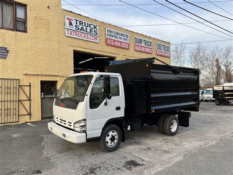 Isuzu NPR 15 Yard Junk Hauler Dump Truck - TA Truck Sales Inc.