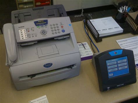 Setting up new fax machine | Elliott Plack | Flickr