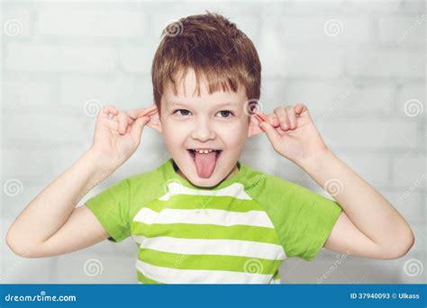 Little Boy, Pulling Himself On The Ears Stock Image - Image: 37940093