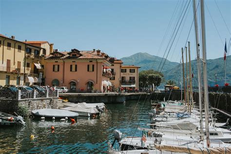 several boats are docked in the water near buildings