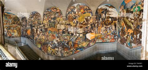 A panoramic view of the stairway mural by Diego Rivera inside the National Palace in Mexico City ...