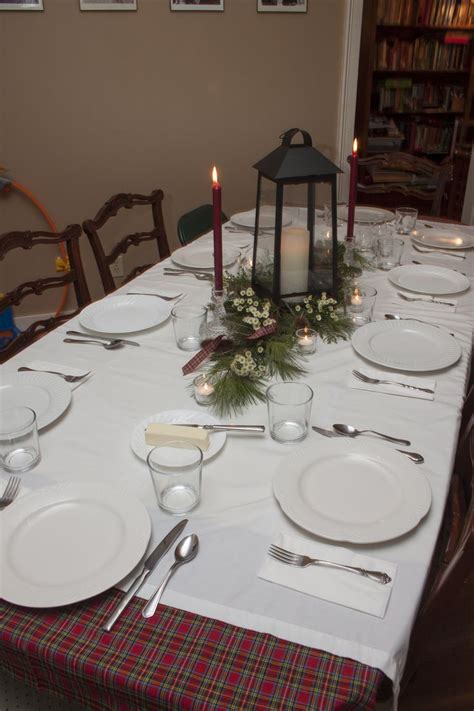 Table decoration for a Burns Night Supper featuring montecasino daisies, greenery and thistle ...