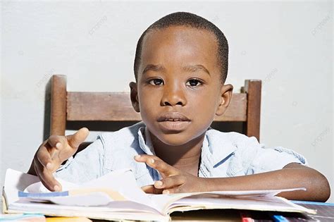 Schoolboy Before His Study Table Learn Sitting Schoolboy Photo ...