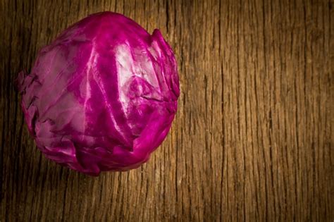 Premium Photo | Cabbage purple on wooden kitchen morning