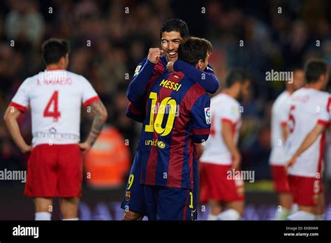 Luis Suarez (FC Barcelona) celebrates with his teammate Lionel Messi ...