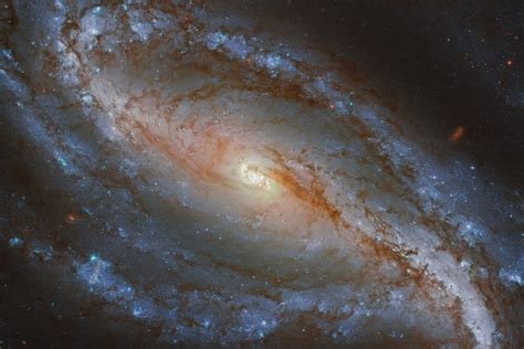 A perfect example of a barred spiral galaxy - Earth.com