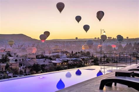 Cave Hotels With The Top View Of The Balloons In Cappadocia