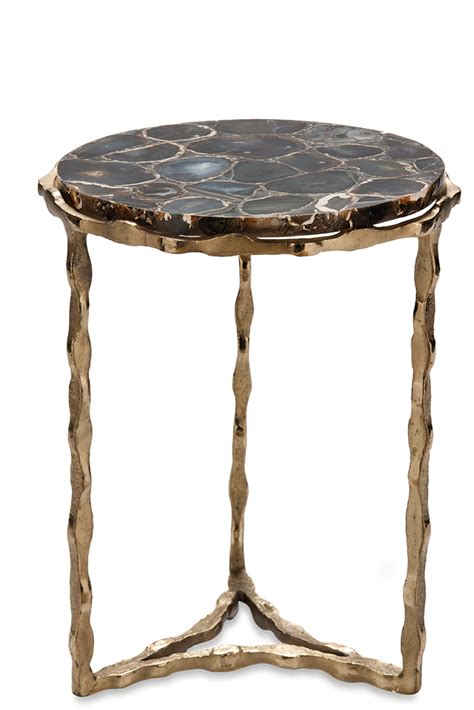 Side table, THEE BLACK, top in black agate, leg pinched rod round in matt and shiny brass platin ...