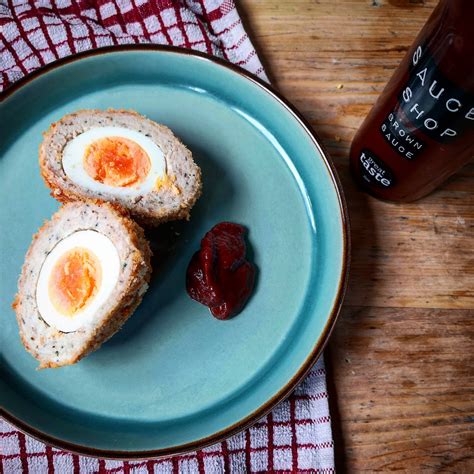 Download Delectable Traditional British Scotch Egg with Brown Sauce ...