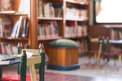 Free Photo | Chairs and table in kids library