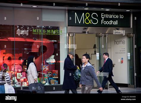 Shoppers walking past Marks & Spencer's Entrance to Food Hall in Oxford ...