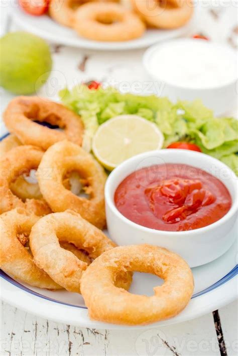 Fried squid rings 22934942 Stock Photo at Vecteezy