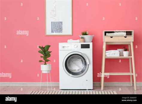 Interior of stylish bathroom with modern washing machine Stock Photo ...