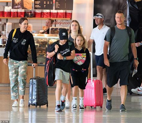 Bec Hewitt and husband Lleyton look cheerful as they head home for ...