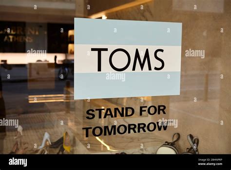 The logo of the brand Toms Shoes on a window Stock Photo - Alamy