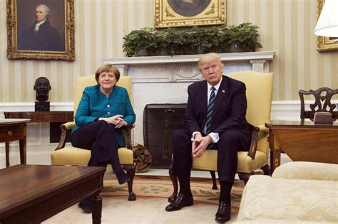 Donald Trump refuses to shake hands with German Chancellor Angela ...