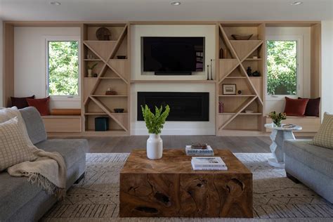 Creative Shelving Shapes Were Designed For This Living Room Wall That Also Includes A TV ...