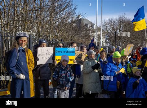 Reykjavik, Iceland - March 13, 2022: People carrying ukrainian colours ...